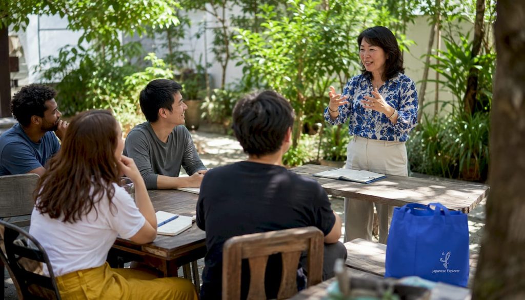 Bilingual Japanese instructor teaching adults in classroom