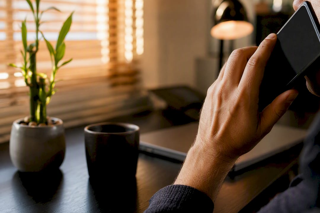 Hands holding phone for Japanese business call