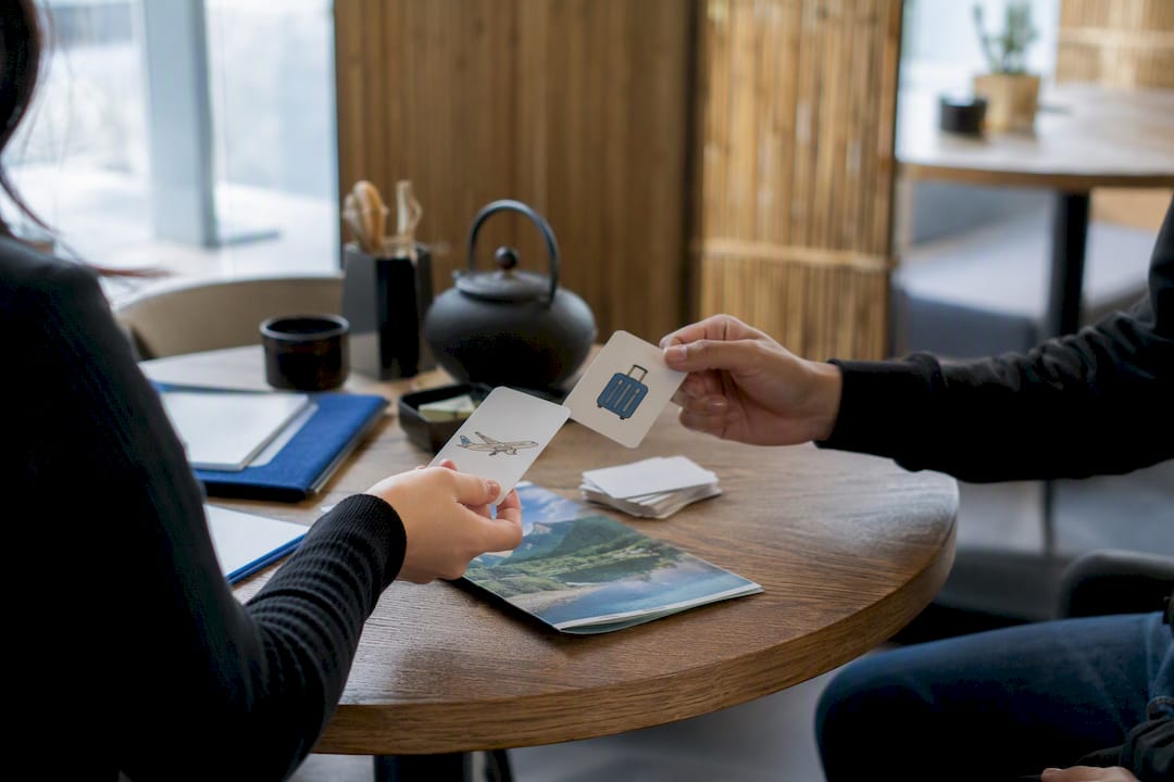 Hands exchanging role-play cards in Japanese class