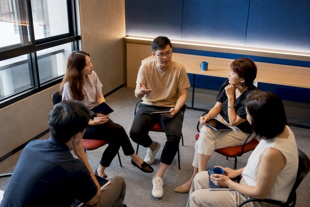Adult learners practising Japanese in group class