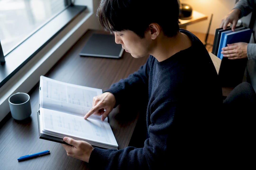Engineer reviewing Japanese technical documentation